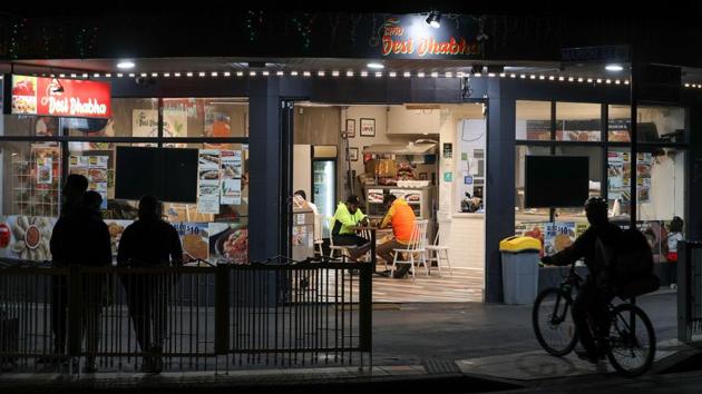 Customers sit inside an Indian restaurant amidst the easing of the coronavirus disease (COVID-19) restrictions, in the Parramatta suburb of western Sydney, Australia, May 29, 2020. Picture taken May 29, 2020. REUTERS/Loren Elliott(REUTERS) Customers sit inside an Indian restaurant amidst the easing of the coronavirus disease (COVID-19) restrictions, in the Parramatta suburb of western Sydney, Australia, May 29, 2020. Picture taken May 29, 2020. REUTERS/Loren Elliott(REUTERS)
