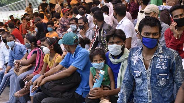 New Delhi, India - May 31, 2020: Stranded migrant workers seen waiting inside Ambedkar Stadium to undergo thermal screening before registering for special trains bound to their home amid the lockdown, in New Delhi, India, on Sunday. (Vipin Kumar/HT Photo) New Delhi, India - May 31, 2020: Stranded migrant workers seen waiting inside Ambedkar Stadium to undergo thermal screening before registering for special trains bound to their home amid the lockdown, in New Delhi, India, on Sunday. (Vipin Kumar/HT Photo)