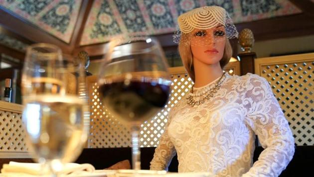 FILE PHOTO: To ensure social distancing does not make diners feel isolated during the coronavirus disease (COVID-19) outbreak, mannequins clad in 1940s-era clothing occupy some tables at The Inn at Little Washington, a Michelin three-star restaurant, which plans to reopen soon in Washington, Virginia, U.S., May 20, 2020. REUTERS/Kevin Lamarque (Reuters)