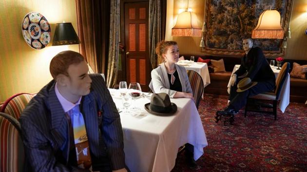 FILE PHOTO: Executive Assistant Jessie Dawson sits among mannequins occupying some tables so diners will not feel isolated by coronavirus disease (COVID-19) social distancing measures when The Inn at Little Washington, a Michelin three-star restaurant, reopens shortly in Washington, Virginia, U.S., May 20, 2020. REUTERS/Kevin Lamarque -/File Photo (REUTERS)