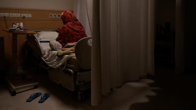 A patient suffering from the coronavirus disease (COVID-19) prays while in the emergency ward of Max Smart Super Speciality Hospital. “Manpower will be the biggest challenge. We have reached the limit,” Dr. Dewan said, adding even as the toll rises, the wait list of patients is growing fast. (Danish Siddiqui / REUTERS)