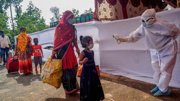 Migrants undergo thermal screening after arriving from various parts of Odisha to board a special train to their native place in Bihar, during the ongoing Covid-19 lockdown, at Bhubaneswar (New) railway station, Monday, May 25, 2020.(PTI file photo)