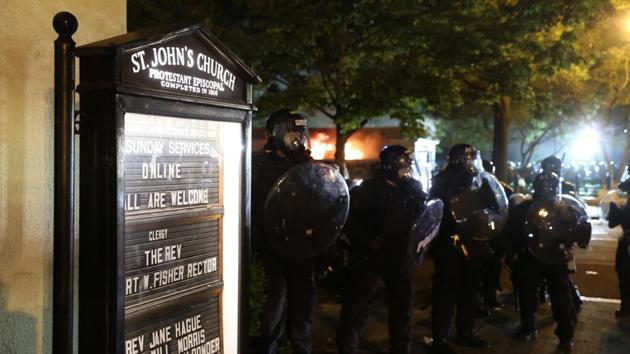 Law enforcement personnel clash with protesters rallying against the death in Minneapolis police custody of George Floyd, near St. John's Church in Washington.(REUTERS) Law enforcement personnel clash with protesters rallying against the death in Minneapolis police custody of George Floyd, near St. John's Church in Washington.(REUTERS)