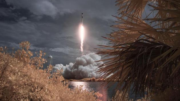 A SpaceX Falcon 9 rocket carrying Crew Dragon spacecraft launches during NASA’s SpaceX Demo-2 mission to the International Space Station with NASA astronauts Robert Behnken and Douglas Hurley onboard, at Kennedy Space Center in Cape Canaveral, Florida, on May 30. (Bill Ingalls / NASA / AP)