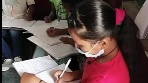 A video grab of students doing their classwork at the school. (HT Photo) A video grab of students doing their classwork at the school. (HT Photo)