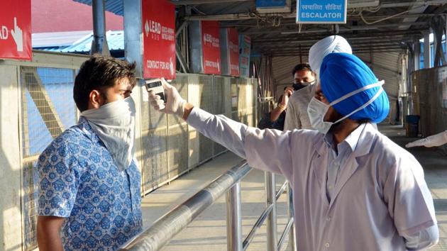 A passenger undergoes thermal screening upon arrival at the Amritsar Junction. According to a statement by Northern Railways on May 31, passengers were advised to carry food and water from home and travel with light luggage. Bedroll and linen will also not be provided by the railways, reported HT. (Sameer Sehgal / HT Photo) A passenger undergoes thermal screening upon arrival at the Amritsar Junction. According to a statement by Northern Railways on May 31, passengers were advised to carry food and water from home and travel with light luggage. Bedroll and linen will also not be provided by the railways, reported HT. (Sameer Sehgal / HT Photo)