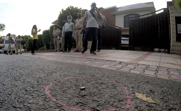 A cartridge shell outside the house of businessman and hotelier Rajesh Singla’s home in Sector 33 where armed gunmen had fired 17 shots on the evening of May 31. A gym owner was rounded up on Tuesday on suspicion of planning the shooting.(Keshav Singh/HT Photo)