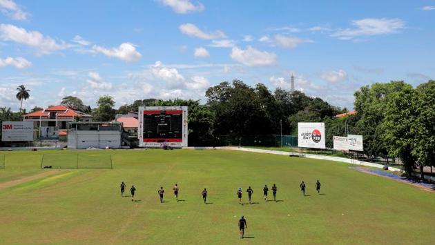 Sri Lankan national cricket team members practice keeping a one meter distance during their first practice session. (REUTERS)