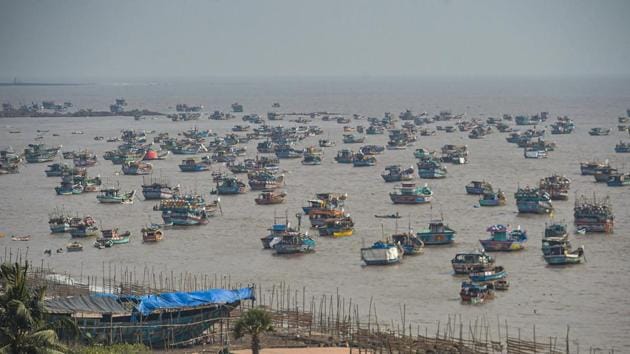 Fishing boats seen anchored at a shore following a warning by Indian Meteorological Department (IMD) for fishermen not to enter the Arabian Sea for the next two days as a precaution against Cyclone Nisarga, at Uttan beach in Thane on Monday.(PTI Photo)