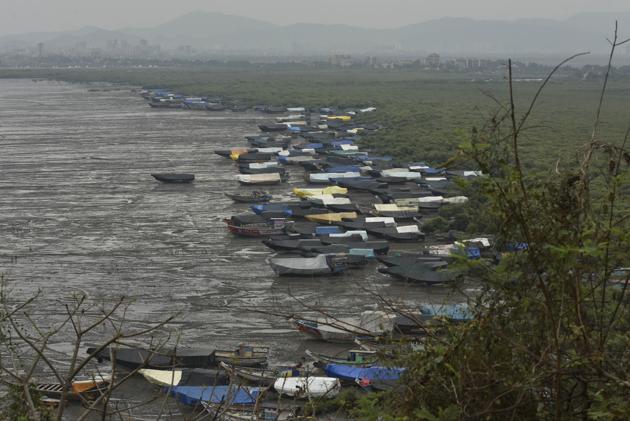 Fisherman parked their boats at the bay in Bhayandar as Cyclone Nisarga is about to hit the western shore in Mumbai on Tuesday. (Hindustan Times) Fisherman parked their boats at the bay in Bhayandar as Cyclone Nisarga is about to hit the western shore in Mumbai on Tuesday. (Hindustan Times)