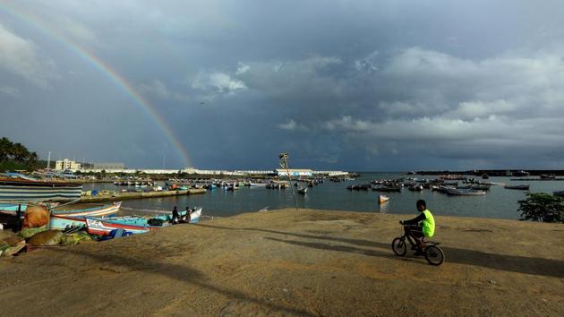 A rainbow forms in Vizhinjam. Rains usually hit Kerala around June 1 and cover the whole country by mid-July. This year the monsoon came just on time and could boost the planting of crops such as rice, soybeans and cotton. (Vivek Nair / HT Photo)