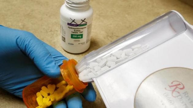 FILE PHOTO: The drug hydroxychloroquine, pushed by U.S. President Donald Trump and others in recent months as a possible treatment to people infected with the coronavirus disease (COVID-19), is displayed by a pharmacist at the Rock Canyon Pharmacy in Provo, Utah, U.S., May 27, 2020. REUTERS/George Frey/File Photo