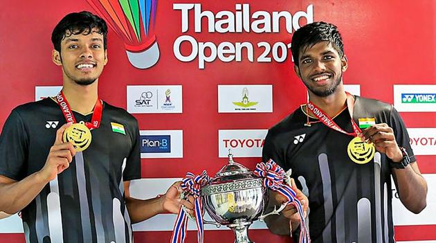 India’s Satwiksairaj Rankireddy and Chirag Shetty pose with their medals and trophy after winning the Thailand Open 2019 badminton doubles title in Bangkok.(PTI)