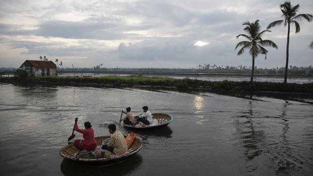 Fishermen row coracles as they set out to fish in the morning in Kochi on June 1. Monsoon rains remain critical for farmers in India, with nearly half its people directly or indirectly depend on agriculture for a living. Millions of farmers depend on the rains to begin the summer sowing. (R S Iyer / AP)