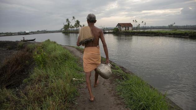 A fisherman sets out to fish in the morning in Kochi on June 1. The country’s rice and cotton growing north-western region could get 107% rainfall of the LTA, while soybean, sugar cane and cotton growing central region could receive 103% rainfall, the IMD said. (R S Iyer / AP)