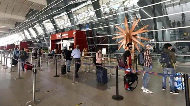 Passengers queue to get their documents verified before entering the IGI Airport amid the lockdown, in New Delhi, India, on Saturday, May 30, 2020.(Sanjeev Verma/HT PHOTO)
