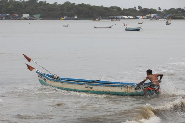A fisherman pulls his boat out of sea to anchor it before cyclone Nisarga makes its landfall, in Mumbai, India.(Photo: Reuters) A fisherman pulls his boat out of sea to anchor it before cyclone Nisarga makes its landfall, in Mumbai, India.(Photo: Reuters)