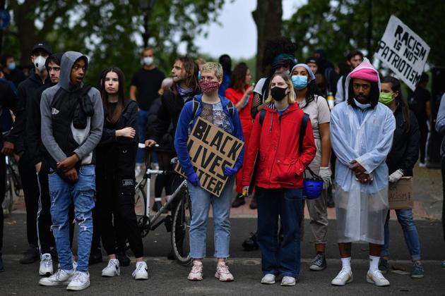 Protestors hold placards during an anti-racism demonstration in London, on June 3, 2020, after George Floyd, an unarmed black man died after a police officer knelt on his neck during an arrest in Minneapolis, USA.(AFP photo)