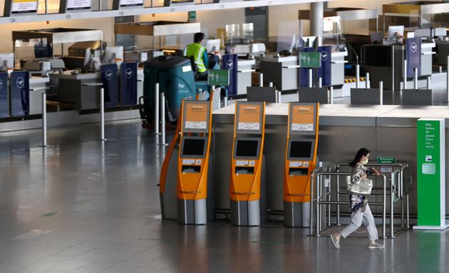 A passengers rushes through the empty check-in area of German air carrier Lufthansa at the airport as the spread of coronavirus disease (COVID-19) continues in Frankfurt, Germany, June 2, 2020. REUTERS/Kai Pfaffenbach (REUTERS)