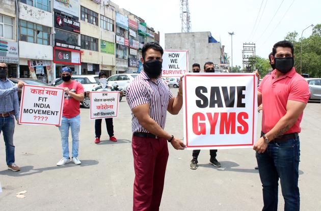 Gym owners protesting in Phase 11, Mohali, on Wednesday. (Gurminder Singh/HT) Gym owners protesting in Phase 11, Mohali, on Wednesday. (Gurminder Singh/HT)