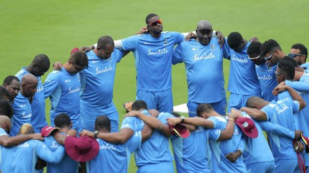 West Indies' Jason Holder, center, and team members huddle during a training session ahead of their first Twenty20 cricket match against India, in Hyderabad.(AP)