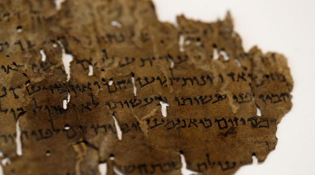 A fragment from the Dead Sea Scrolls that underwent genetic sampling to shed light on the 2,000-year-old biblical trove is shown to Reuters at the Israel Antiquities Authority (IAA) laboratory in Jerusalem June 2, 2020. REUTERS/Ronen Zvulun(REUTERS)