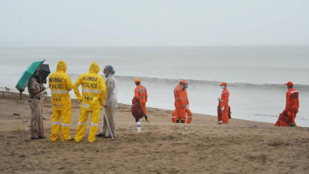 Mumbai Police and NDRF teams seen at Versova beach during an evacuation drive in Mumbai. The NDRF personnel on ground witnessed Nisarga make landfall between Murud and Revdanda areas in Raigad district, just south of Alibaug. (PTI)