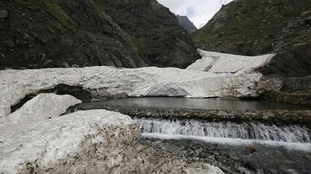 A melting glacier feeds a stream along the route taken by the Bakarwals on their way down to the meadows and eventually towards Kashmir Valley. (Waseem Andrabi / HT Photo) A melting glacier feeds a stream along the route taken by the Bakarwals on their way down to the meadows and eventually towards Kashmir Valley. (Waseem Andrabi / HT Photo)