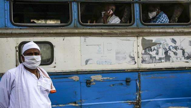 A masked passenger stands outside an interstate bus in Kolkata, in the eastern Indian state of West Bengal, Wednesday, June 3, 2020. More states opened up and crowds of commuters trickled onto the roads in many of India's cities on Monday as a three-phase plan to lift the nationwide coronavirus lockdown began despite an upward trend in new infections. (AP Photo/Bikas Das)(AP)