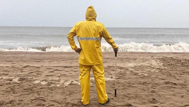 The image shows a Mumbai Police official standing on a beach. (Instagam/Mumbai Police) The image shows a Mumbai Police official standing on a beach. (Instagam/Mumbai Police)