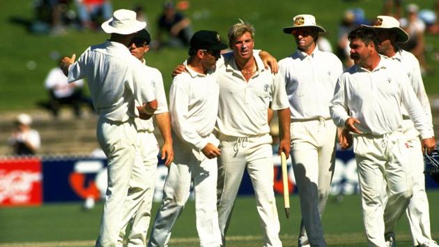 Allan Border of Australia congratulates team mate Shane Warne after the Third Test match against South Africa at the Adelaide Oval in Australia. Australia won the match by 191 runs. Mandatory Credit: Allsport UK Allsport(Getty Images)