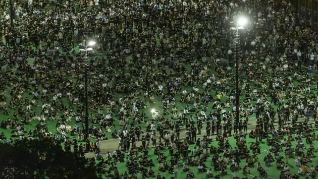 People sit spaced apart as they gather at Victoria Park to commemorate the 31st anniversary of the Tiananmen Square crackdown in Hong Kong, China, on June 4. The defiant gathering came hours after pro-Beijing lawmakers in Hong Kong’s legislature succeeded in passing a bill criminalising insults to China’s national anthem. (Justin Chin / Bloomberg ) People sit spaced apart as they gather at Victoria Park to commemorate the 31st anniversary of the Tiananmen Square crackdown in Hong Kong, China, on June 4. The defiant gathering came hours after pro-Beijing lawmakers in Hong Kong’s legislature succeeded in passing a bill criminalising insults to China’s national anthem. (Justin Chin / Bloomberg )