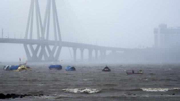 Fishing boats are pictured in a turbulent sea as the Bandra-Worli Sea Link stands in the background. Heavy rain and winds lashed Mumbai as Cyclone Nisarga barrelled towards the city on June 3. Two people in Raigad district and two more in Pune district died, while eight people were injured in Sindhudurg and Ratnagiri, state officials confirmed. (Pratik Chorge / HT Photo) Fishing boats are pictured in a turbulent sea as the Bandra-Worli Sea Link stands in the background. Heavy rain and winds lashed Mumbai as Cyclone Nisarga barrelled towards the city on June 3. Two people in Raigad district and two more in Pune district died, while eight people were injured in Sindhudurg and Ratnagiri, state officials confirmed. (Pratik Chorge / HT Photo)