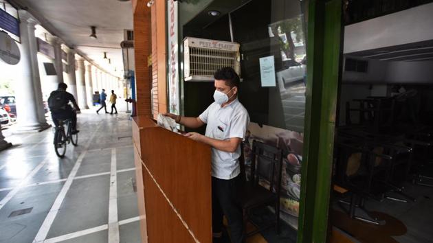 A man wearing a facemask seen outside a restaurant in Connaught Place, New Delhi on Monday. (Raj K Raj/HT PHOTO) A man wearing a facemask seen outside a restaurant in Connaught Place, New Delhi on Monday. (Raj K Raj/HT PHOTO)