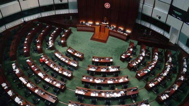 The chamber’s pro-democracy faction refused to cast their votes and instead shouted slogans denouncing the law. (Reuters Photo) The chamber’s pro-democracy faction refused to cast their votes and instead shouted slogans denouncing the law. (Reuters Photo)