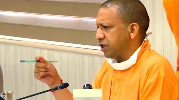 Adityanath accused the Congress of “playing with lives” and reeled of numbers, suggesting that the vehicle details submitted by the Congress showed that they were not actual buses. (HT photo)