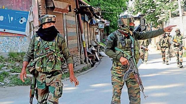 Security personnel cordon off the area after militants fired on a police team in Kulgam on Thursday. Security personnel cordon off the area after militants fired on a police team in Kulgam on Thursday.