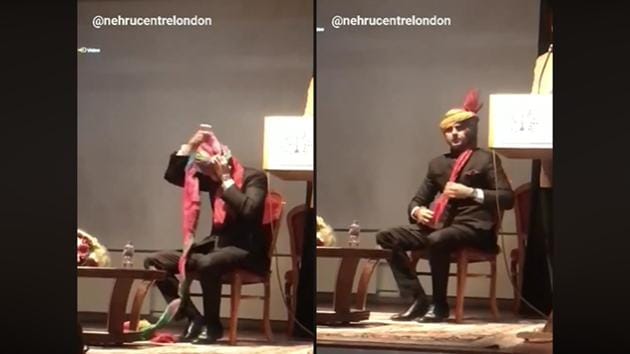 Sachin Pilot sitting on stage for a panel discussion and tying the Safa. Sachin Pilot sitting on stage for a panel discussion and tying the Safa.
