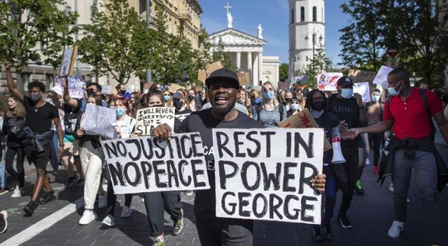 Protesters take part in a demonstration in Vilnius, Lithuania over the death of George Floyd (AP) Protesters take part in a demonstration in Vilnius, Lithuania over the death of George Floyd (AP)
