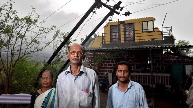 The Gharat family, who live in Navedar Beli village near Murud, lost a floor of their creek-facing house and the restoration is likely to cost them ₹4 lakh.(Satish Bate/HT Photo)