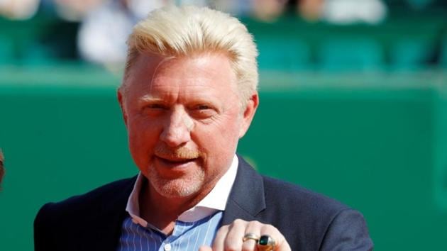 Boris Becker is awarded with the international tennis hall of fame ring to honour his career.(REUTERS)