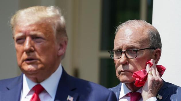 White House economic adviser Larry Kudlow listens as US President Donald Trump talks about a US jobs report amid the coronavirus disease (COVID-19) pandemic during a news conference in the Rose Garden at the White House in Washington, US. (REUTERS) White House economic adviser Larry Kudlow listens as US President Donald Trump talks about a US jobs report amid the coronavirus disease (COVID-19) pandemic during a news conference in the Rose Garden at the White House in Washington, US. (REUTERS)