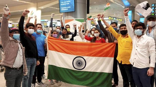 Indian nationals stranded in Moscow pose for a photograph before being airlifted under the Vande Bharat Mission in the wake of the coronavirus pandemic in Moscow on June 3. The first two phases of Vande Bharat Mission, India’s largest repatriation operation has brought back a total of 107,123 Indians. (PTI) Indian nationals stranded in Moscow pose for a photograph before being airlifted under the Vande Bharat Mission in the wake of the coronavirus pandemic in Moscow on June 3. The first two phases of Vande Bharat Mission, India’s largest repatriation operation has brought back a total of 107,123 Indians. (PTI)
