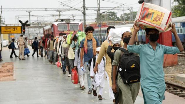 Migrants who arrived from Ghaziabad on a Shramik special train, exit Danapur station, in Patna on June 3. Government officials told HT that the most efficient way forward considering present demand is by means of buses. Trains may run if there are adequate numbers to make them feasible. (Santosh Kumar / HT Photo)