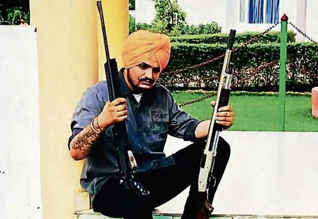 On May 4, Barnala police had booked Moose Wala and eight others in for violating curfew after a video of him firing an official assault rifle went viral on social media. Seven cops, including a DSP, have been suspended in the matter. Later, Sangrur police booked Moose Wala, his friends and some cops after another video of the singer surfaced where he was seen firing from a private pistol at Ladda Kothi shooting range.(HT PHOTO)