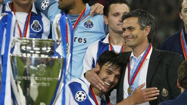 Nuno Valente of FC Porto hugs his manager Jose Dos Santos Mourinho after winning the Champions League during the UEFA Champions League Final match between AS Monaco and FC Porto at the AufSchake Arena on May 26, 2004 in Gelsenkirchen, Germany.(Getty Images)