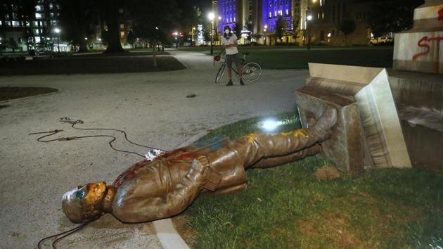The statue of Confederate Gen. Williams Carter Wickham lies on the ground after protesters pulled it down Saturday, June 6, 2020, in Monroe Park in Richmond, Va. The statue had stood in the park since 1891. (AP) The statue of Confederate Gen. Williams Carter Wickham lies on the ground after protesters pulled it down Saturday, June 6, 2020, in Monroe Park in Richmond, Va. The statue had stood in the park since 1891. (AP)