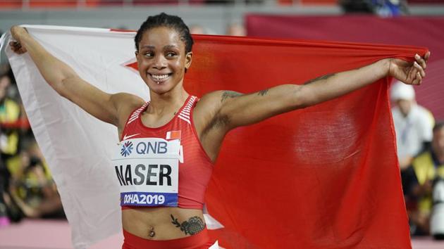 Salwa Eid Naser of Bahrain, celebrates after winning gold in the women's 400 meter final at the World Athletics Championships in Doha, Qatar.(AP)