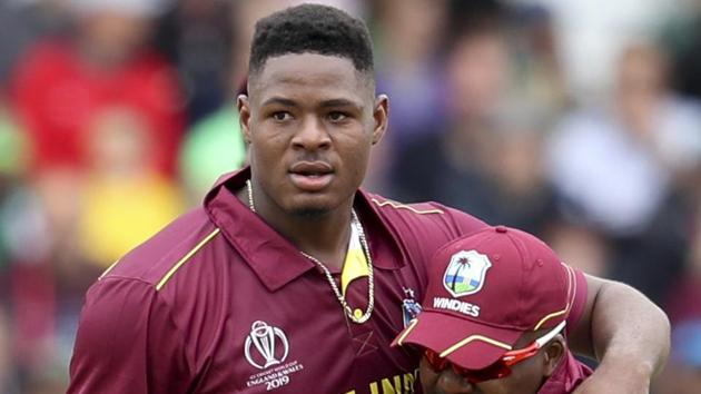 West Indies' bowler Oshane Thomas is embraced by teammate Darren Bravo.(AP)