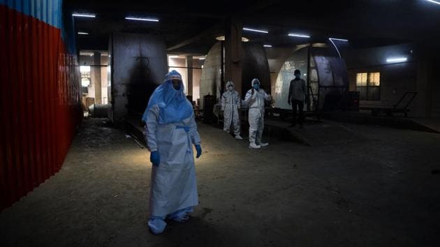 The committee that runs Nigambodh Ghat told AFP the crematorium has handled more than 500 coronavirus funerals in two months. Authorities have ordered victims be incinerated in modern furnaces as a precaution against infection. (Sajjad Hussain / AFP)